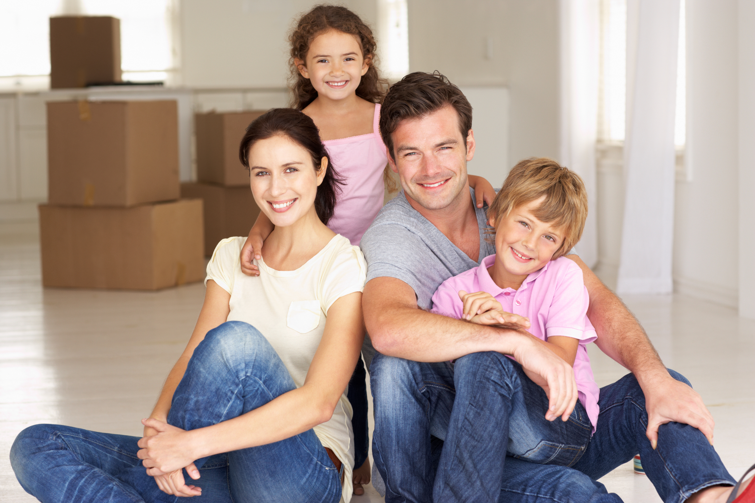 Young family with boxes